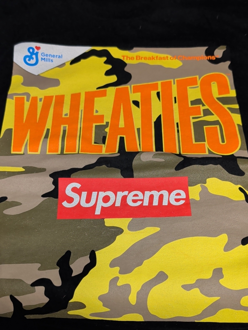 Supreme Box Logo Tee with Yellow & Olive Camo and Orange Wheaties Print